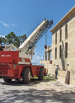 Using the crane to lift the laminated beam.