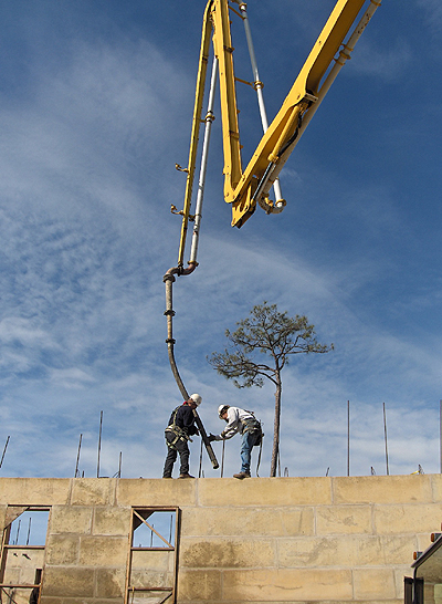 Pumping concrete into the hollow cavity of the dacart concrete blocks.