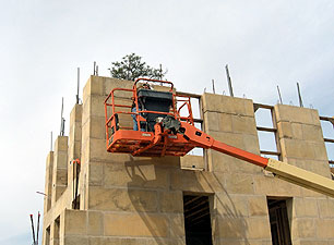 Man lift adjustable arm track rental construction equipment