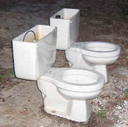 Salvage toilets on side of the road