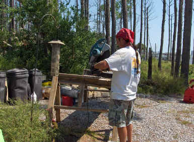 Don cutting a block.