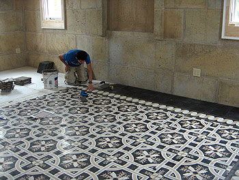 laying the cement tile in the big bedroom