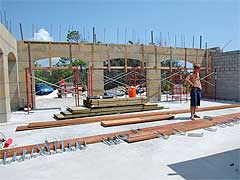 Interior of garage area of man made limestone block house