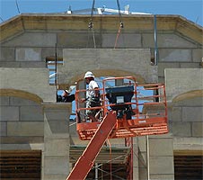 Lowering the stone arch into place
