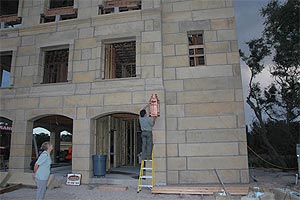 Mary Nasello looking at exterior gas lantern placement