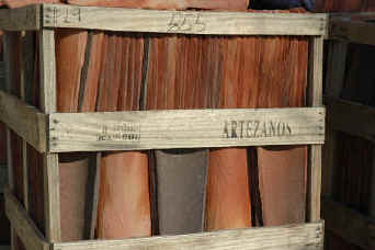 Terra cotta clay roof tiles in shipping crates