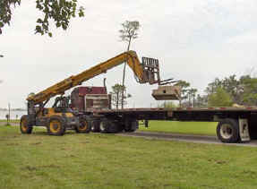 Using a rented lull to lift a dac-art cornice block for villa lagoon house.