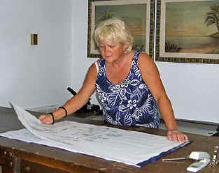 Melody Davis of AESC looking at house plans